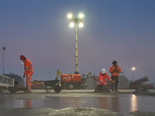 Two lighting tower generators at a construction site