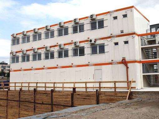 Set-up of dozens of modular units for temporary accommodation